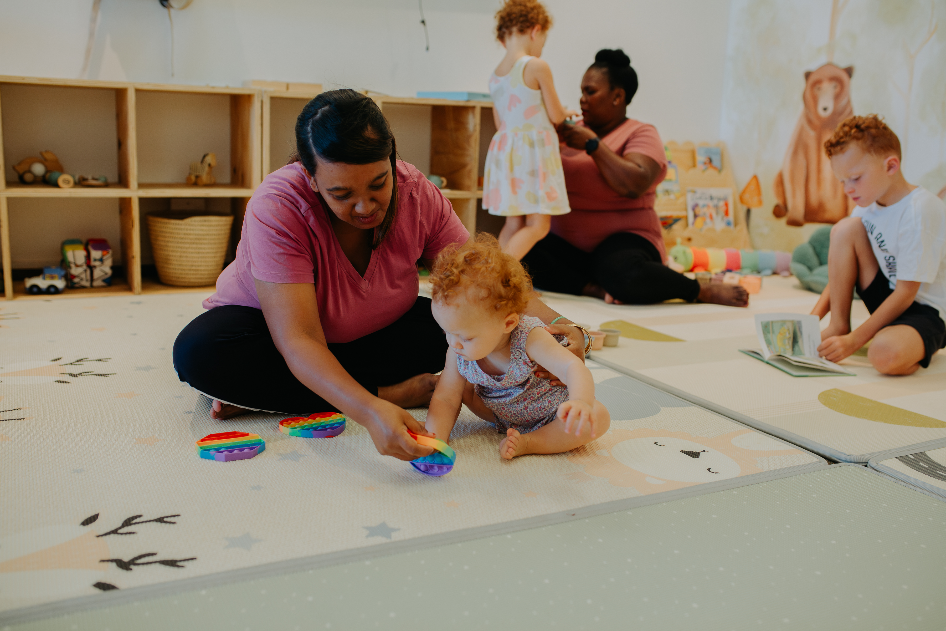 Read.Work.Play nanny playing with a child